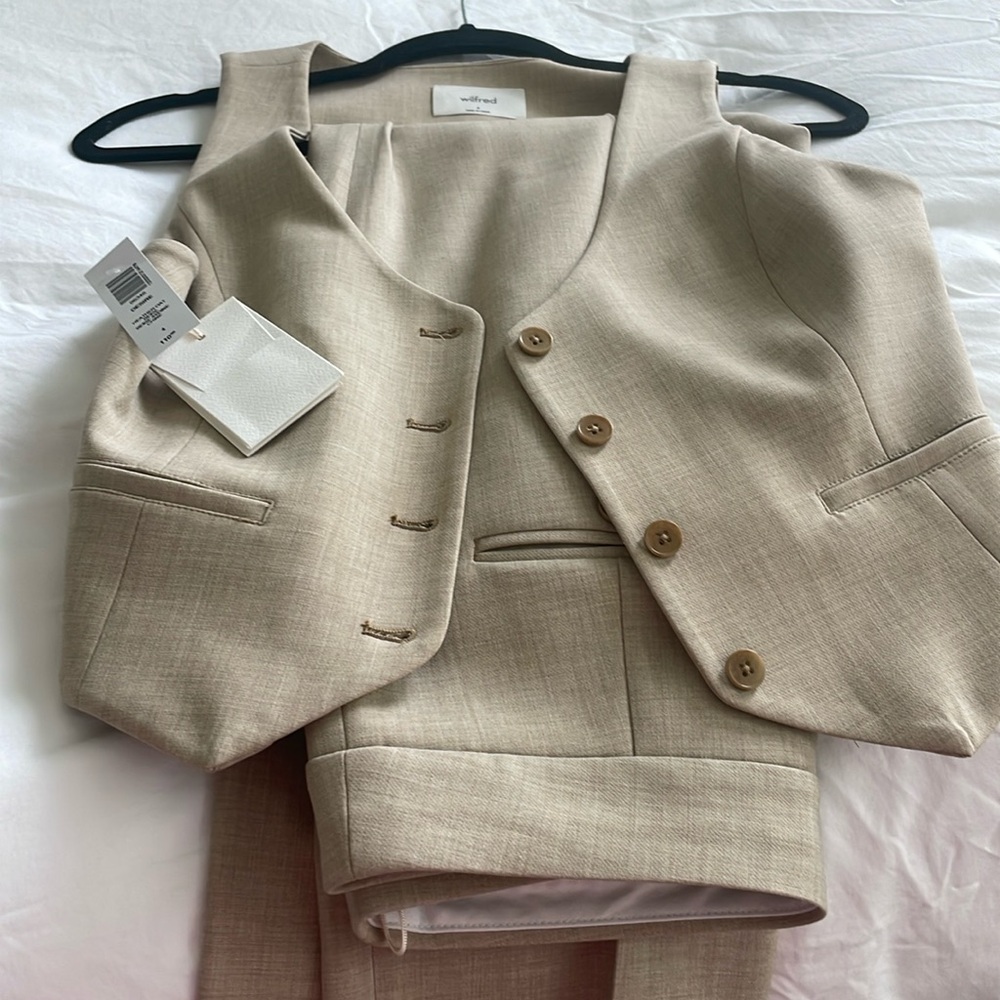 Matching vest and pant set. Vest has never been worn, pants worn once